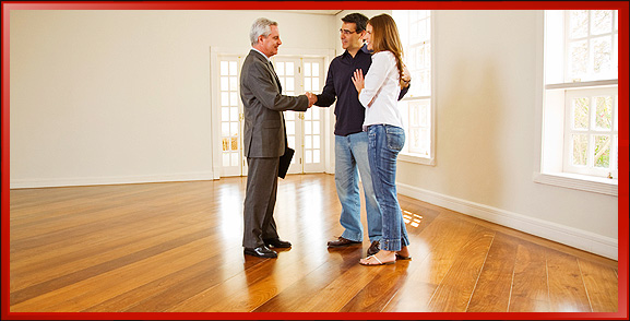 Real Estate Agent Touring Home with Young Couple